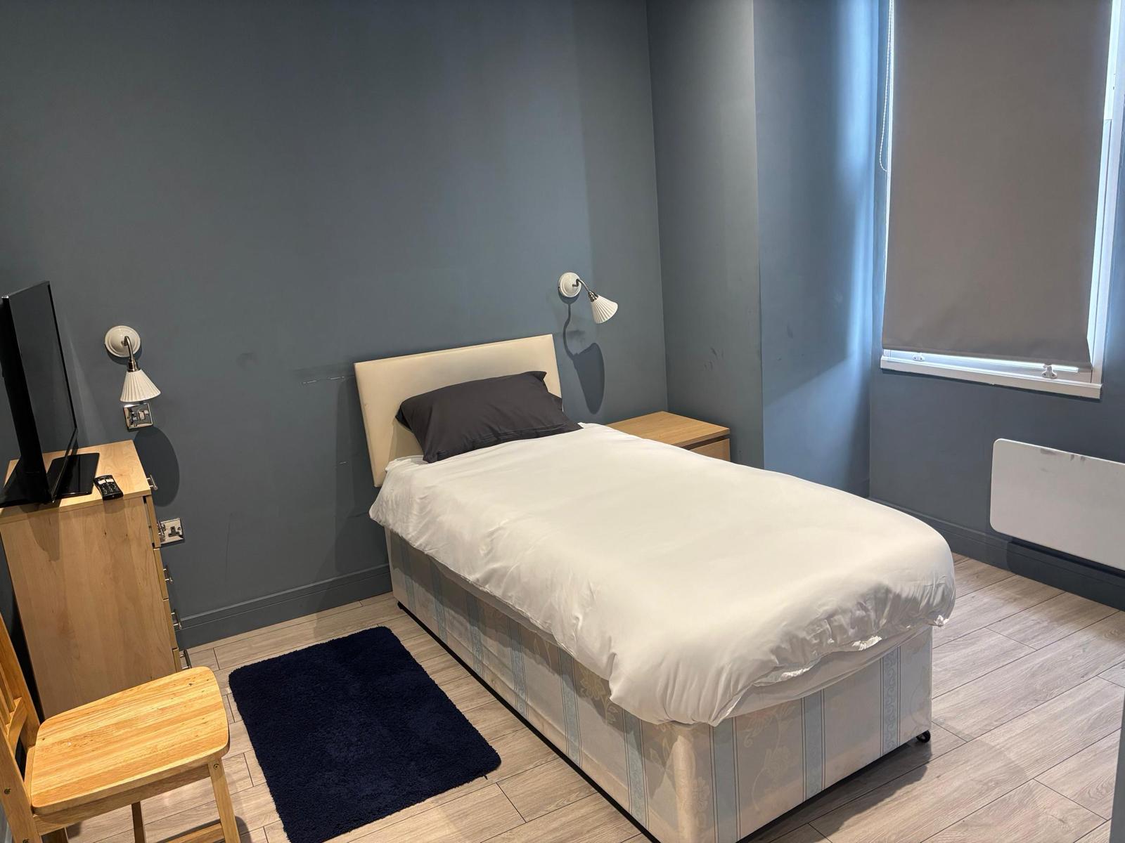 Despard bedroom with TV and desk