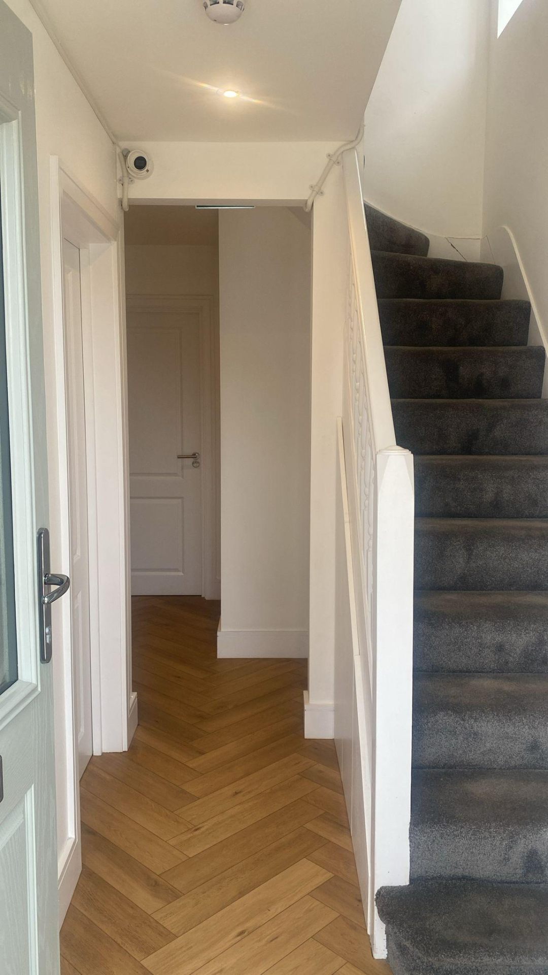 Hughenden Gardens hallway with herringbone flooring