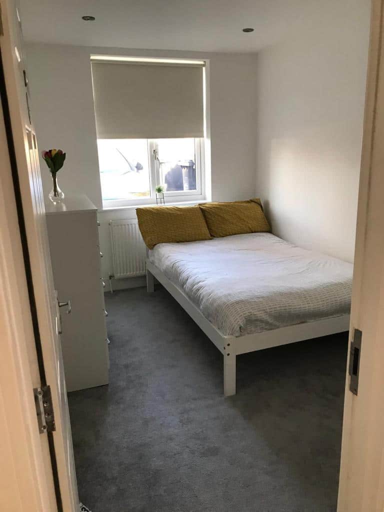 Ravenor Park bedroom with yellow pillows